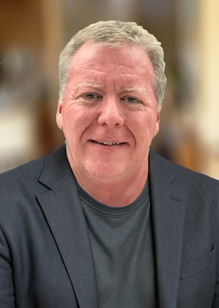 Portrait of a male business owner in a dark suit.